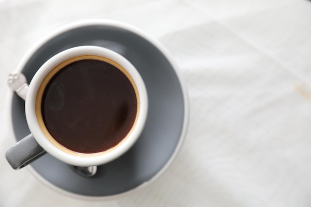 Coffee cup in white table