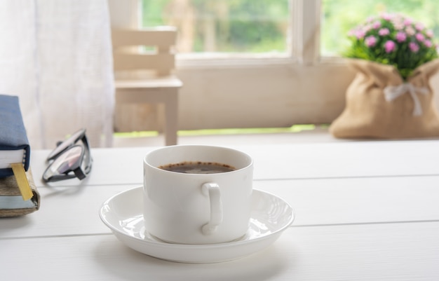 Coffee cup and window in nature