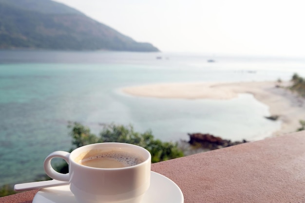 Coffee cup with beautiful beach in the summer time Concept travel holiday and vacation Nature landscape at Lipe island in Thailand