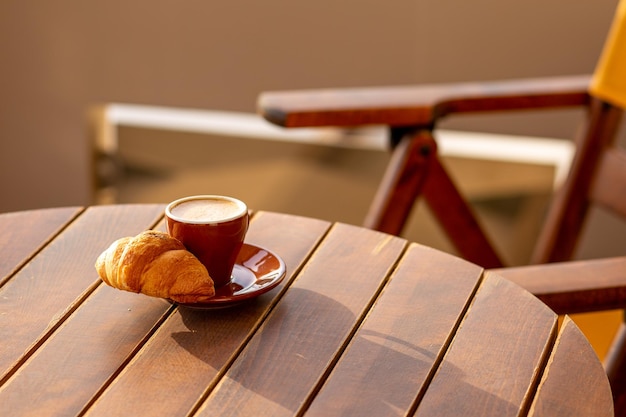 Coffee in a cup with a croissant for breakfast Espresso with croissant for breakfast Breakfast