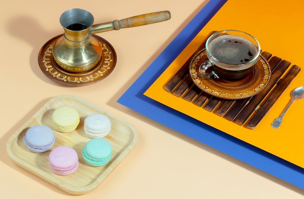 Coffee in a cup with dessert on a bright colored background