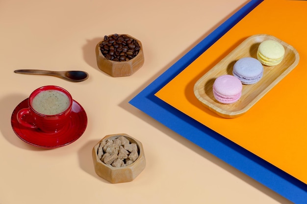 Coffee in a cup with dessert on a bright colored background