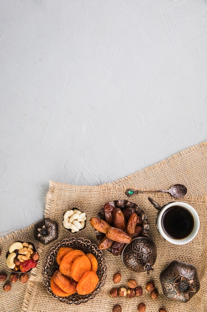 Coffee cup with dried fruits and nuts 