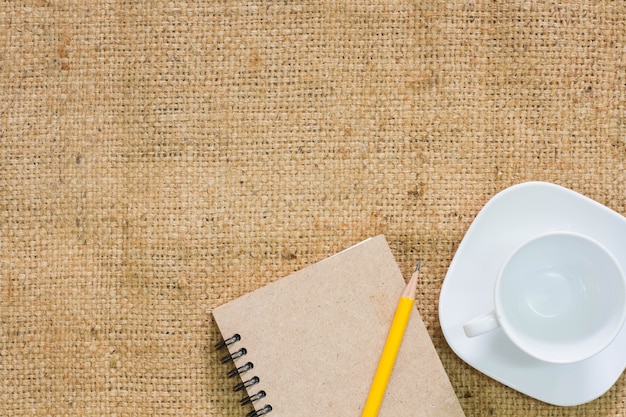 Coffee cup with notebook