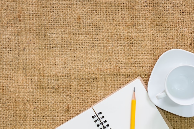 Coffee cup with notebook