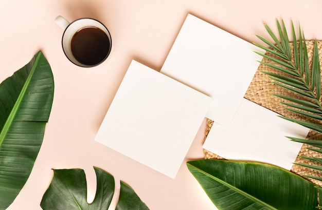 Coffee cup with palm leaf on pink wall