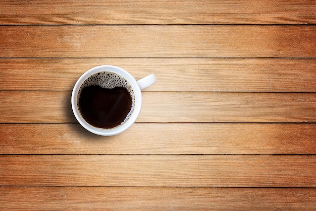 Coffee cup on wooden table top view