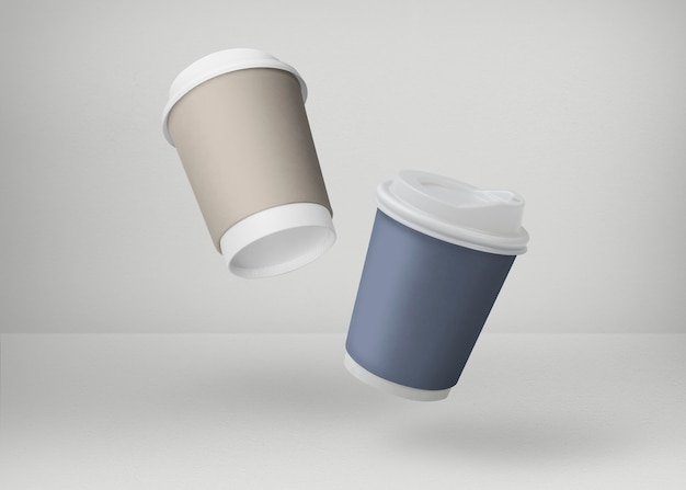 Coffee cups in blue and gold on white backdrops