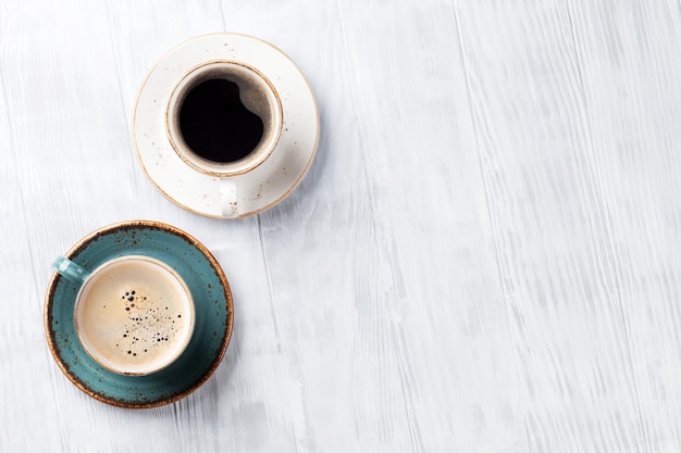 Coffee cups on wooden kitchen table