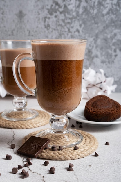 Coffee foam is poured into a mug with oat milk Making latte Vertical orientation