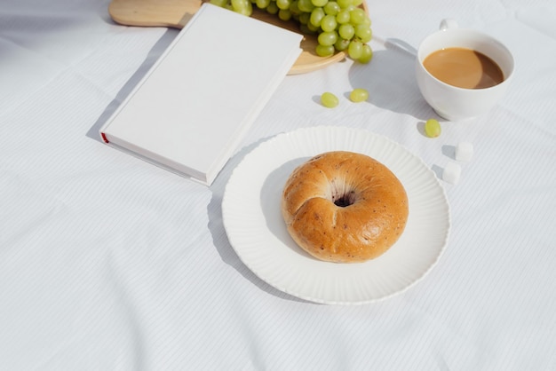 Coffee a good book and bread for a good morning in cafeteria