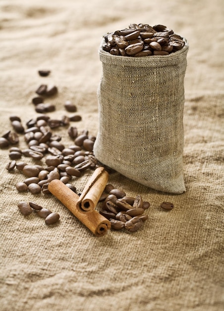 Coffee grains in bag with cinnamon