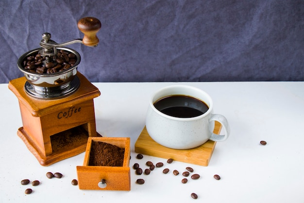 Coffee grinder, maker, cup and beans, morning coffee, energy drink