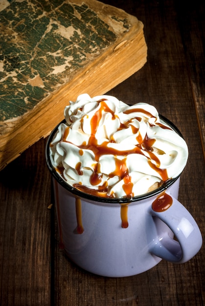 Coffee or hot chocolate and old book