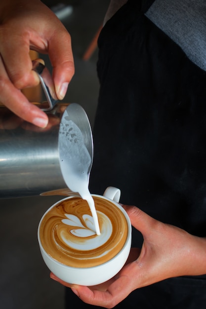 Coffee latte art, pouring milk