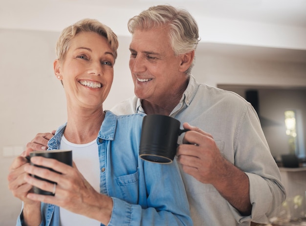 Coffee love and old couple smile in home drinking beverage caffeine or cappuccino Relax retirement and tea with elderly happy married man and woman together care affection and support in house