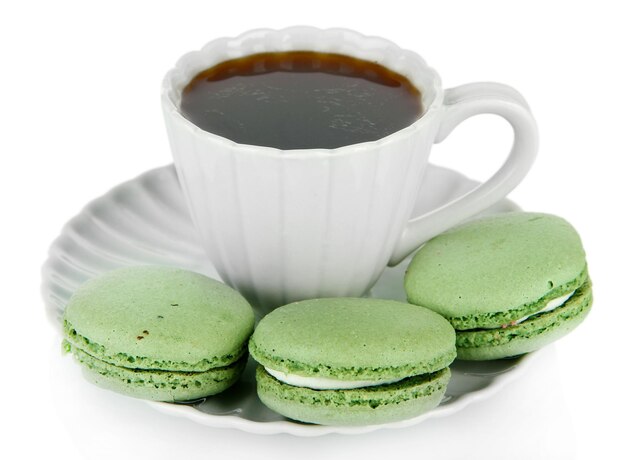 Coffee and macaroons isolated on white