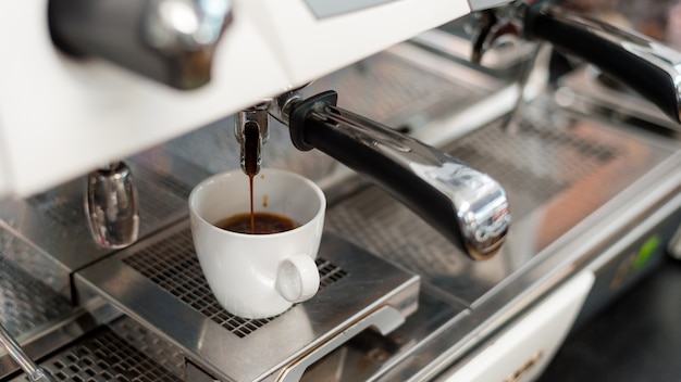 Coffee machine making a black coffee