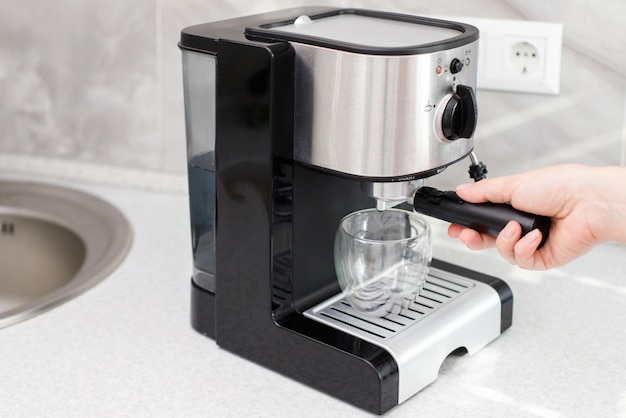 Coffee machine on the table in the kitchen at home