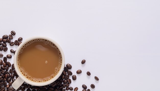 Coffee mug, coffee beans, white background scene