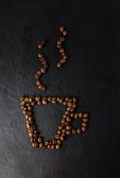 Coffee mug lined with coffee beans