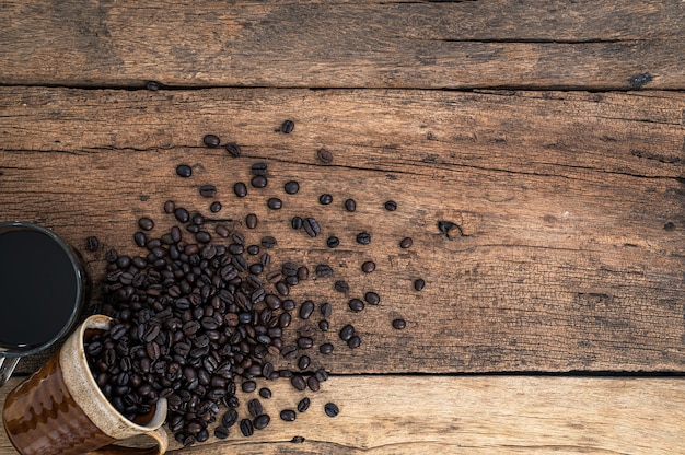 Coffee mugs and coffee beans are on the desk