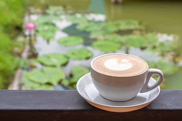 Coffee Mugs white plate with The heart shaped makeup on iron balconies 