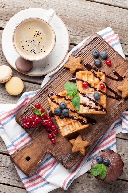 Coffee sweets and waffles with berries