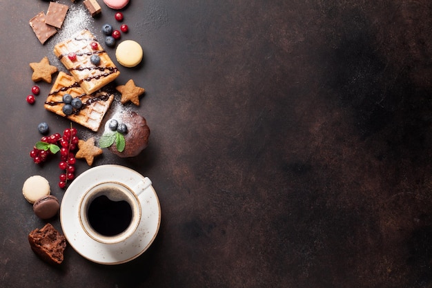 Coffee sweets and waffles with berries