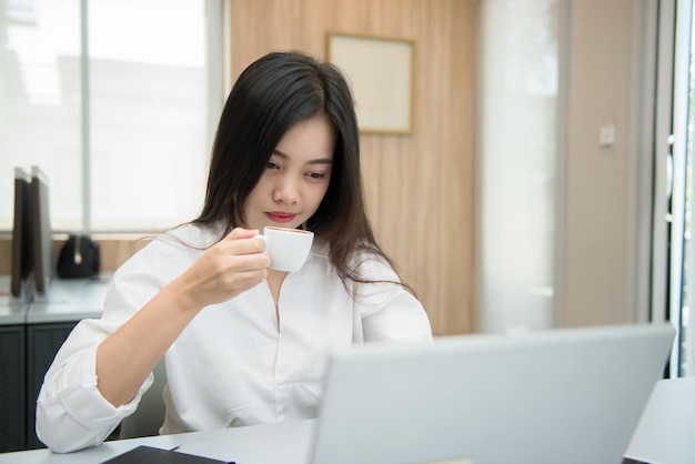 Coffee time of office woman wear glasses in the office