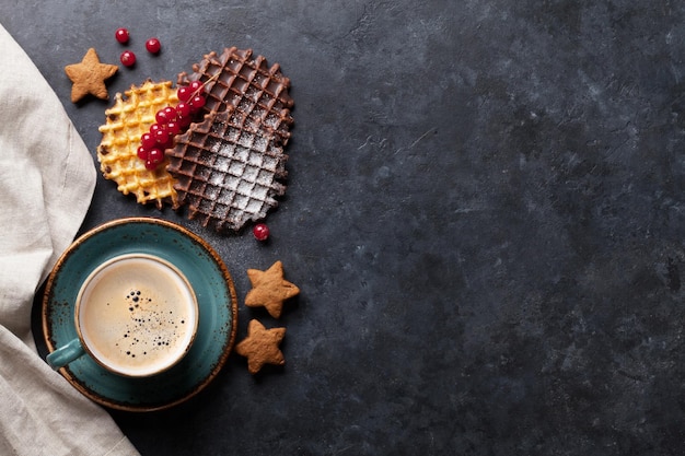 Coffee and waffles with berries