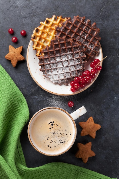 Coffee and waffles with berries