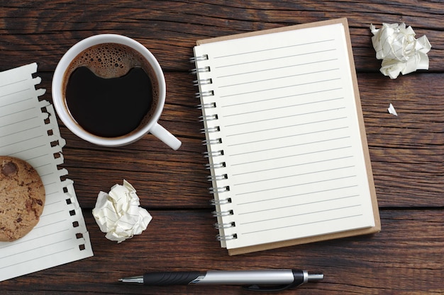 Coffee with cookie and notebook