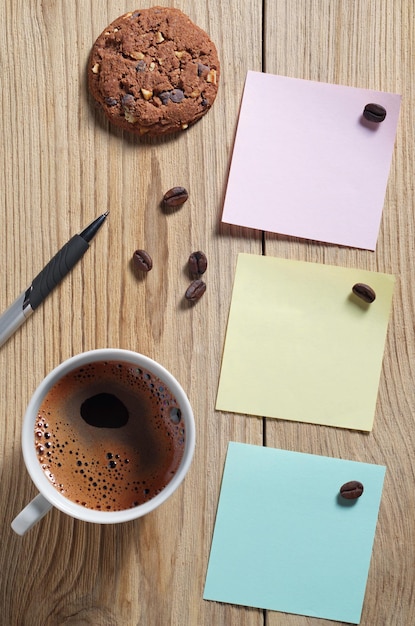 Coffee with cookies and paper stickers