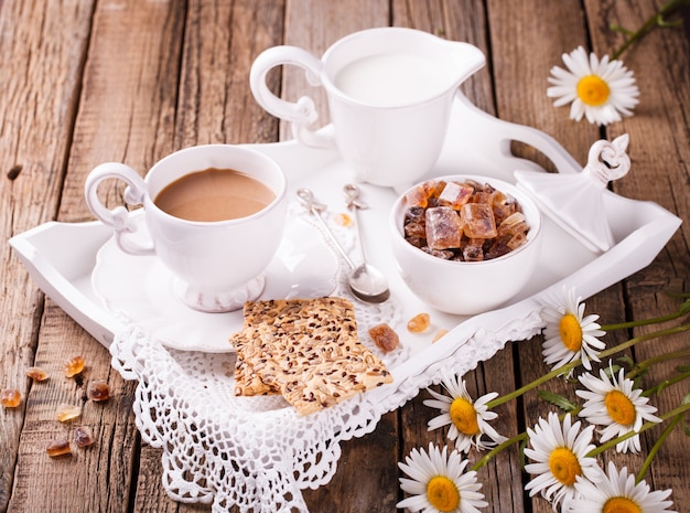 Coffee with milk and cookies.