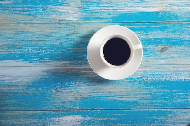 Coffee on wooden background .