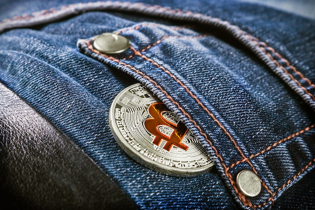 Coin cryptocurrency bitcoin in your jeans pocket 