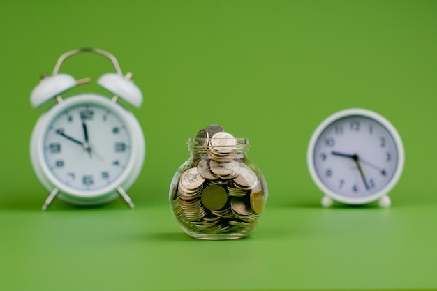 Coin in glass jar saving money in a glass jar saving money concept salary income wages