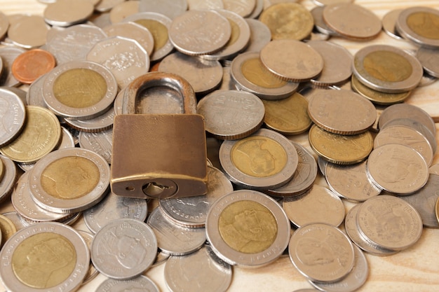 Coin money (Thai BAHT) and lock. Saving and financial security concept.finance, economy concept.