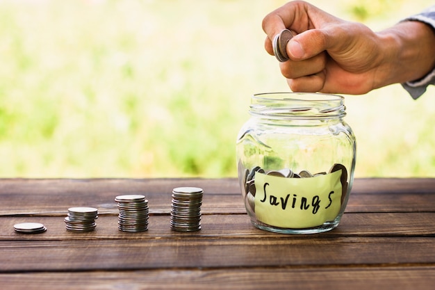 Coins stack and jar with saving coins