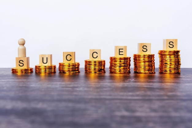 Coins Stack and Success Text Business and Financial Concept