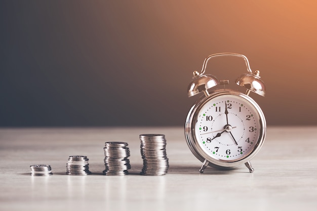 Coins with clock on table