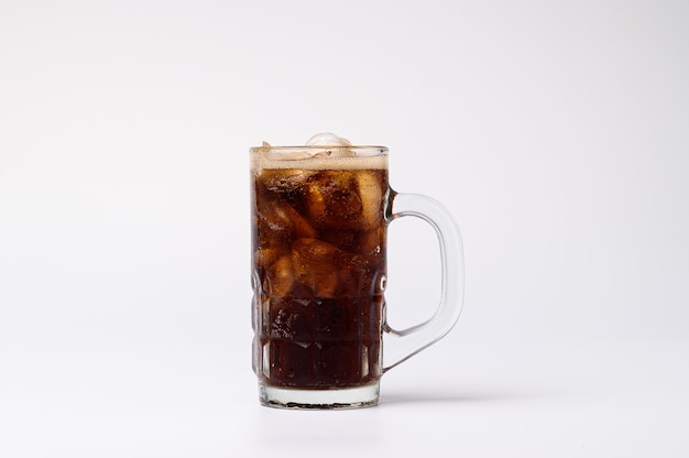 Cola in glass with clear ice cubes isolated on white background