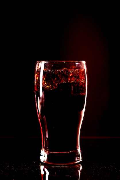 Cola glass with ice cubes and droplets, isolated and with clipping path