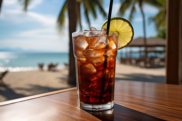 Cola with ice cubes and lemon on the background of the sea