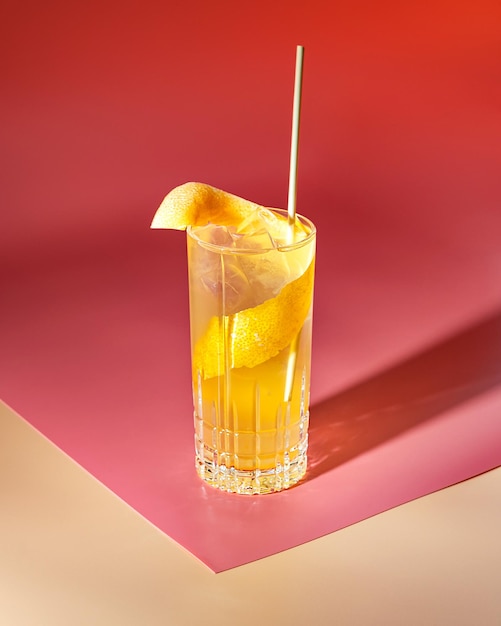 Cold alcoholic or nonalcoholic cocktail on pastel background Hard light deep shadow