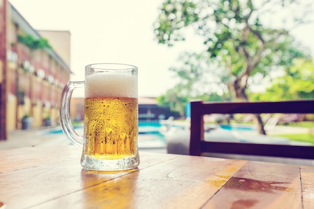 Cold Beer glass on the table at the open-air cafe