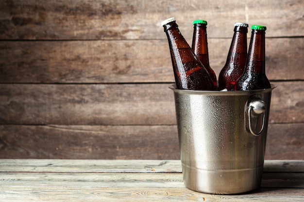 Cold bottles of beer in the bucket