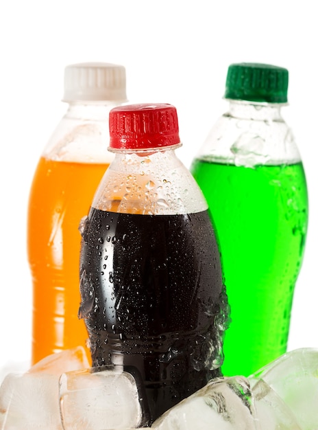 Cold bottles of soda in ice