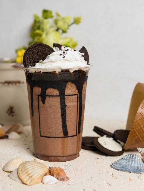 Cold chocolate drink in plastic cup close up